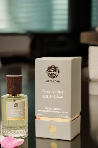 ALGADHI Rosa Amber Perfume - Elegant glass bottle with gold accents and Arabian motifs, showcasing "EAU DE PARFUM VAPORISATEUR NATURAL SPRAY" text.