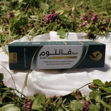 عبوة زيت سيلا فانتوم في بيئة طبيعية - مزيج من الزيوت الطبيعية لتغذية وتقوية الشعر.